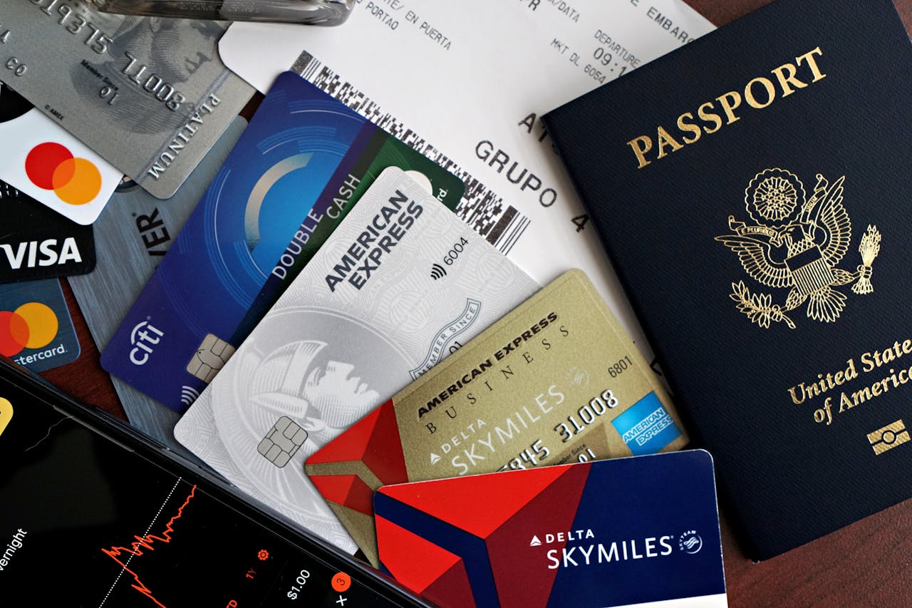 our-experience A collection of travel essentials including a passport, credit cards, and a boarding pass. Ideal for travel and finance concepts.